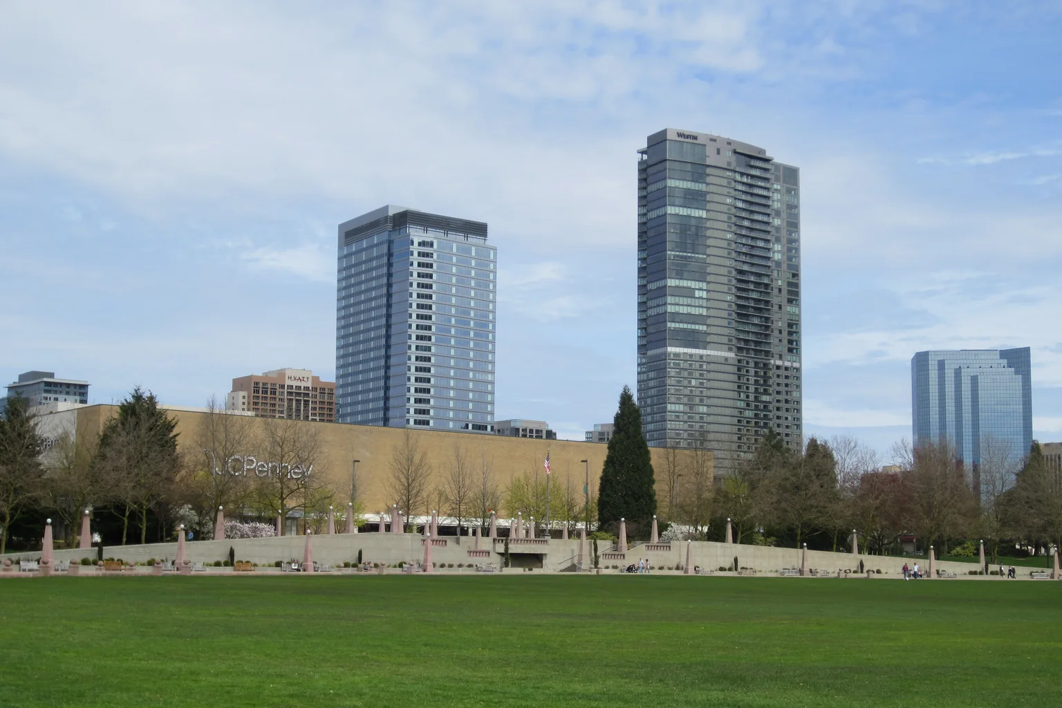 Downtown Bellevue's high-rise towers rising above the lawn at Bellevue Downtown Park